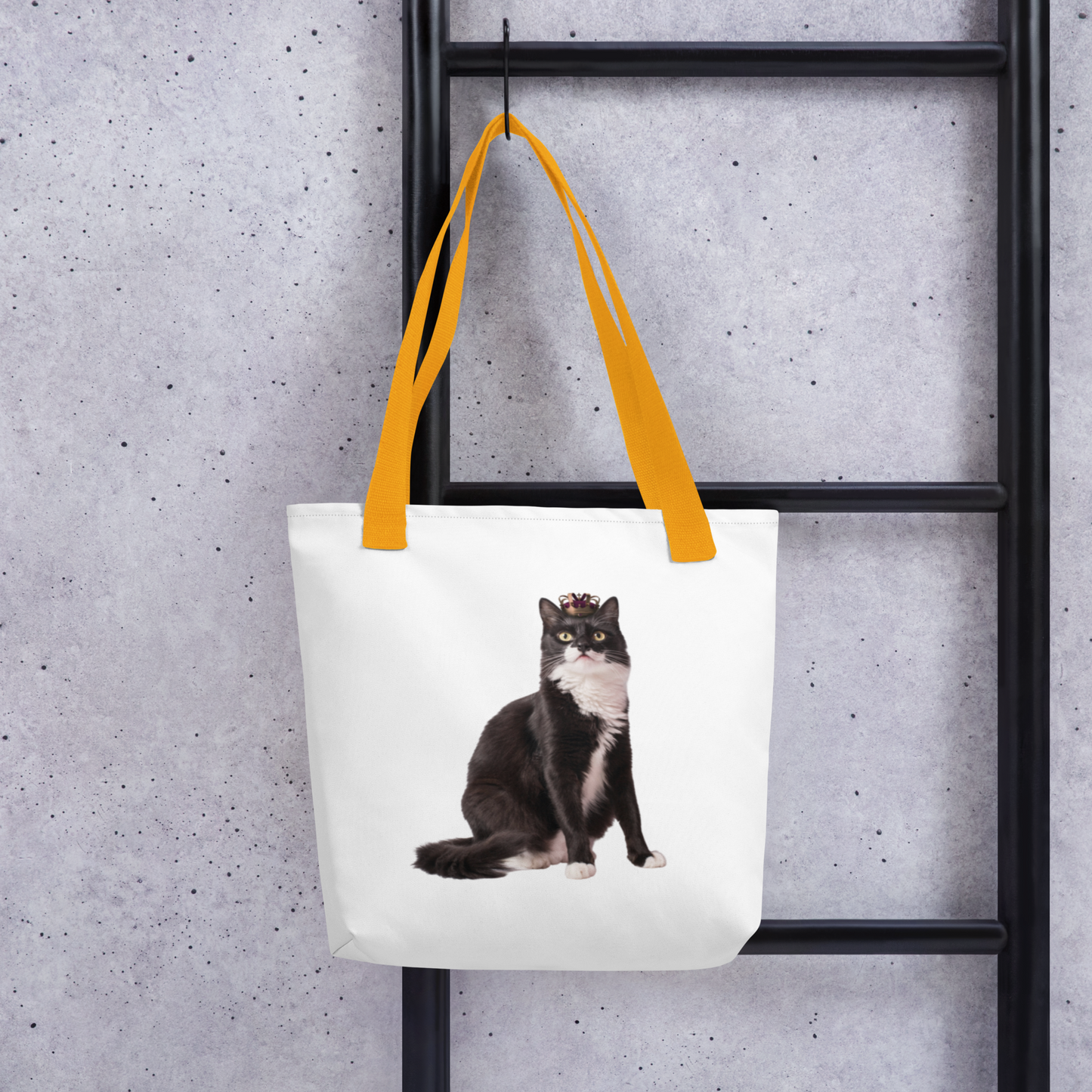 Custom cat photo tote bag styled on a wooden ladder, tuxedo cat print