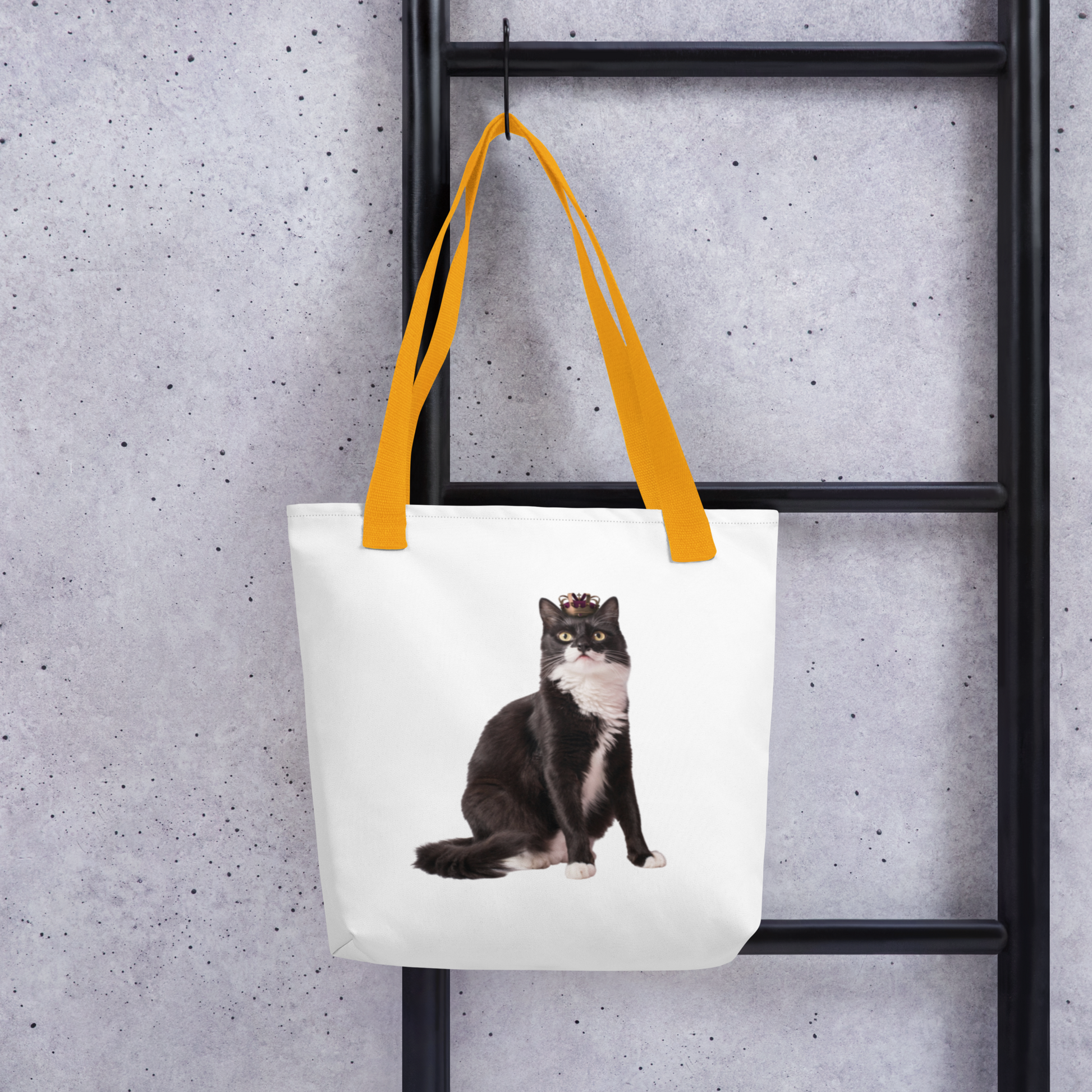 Custom cat photo tote bag styled on a wooden ladder, tuxedo cat print
