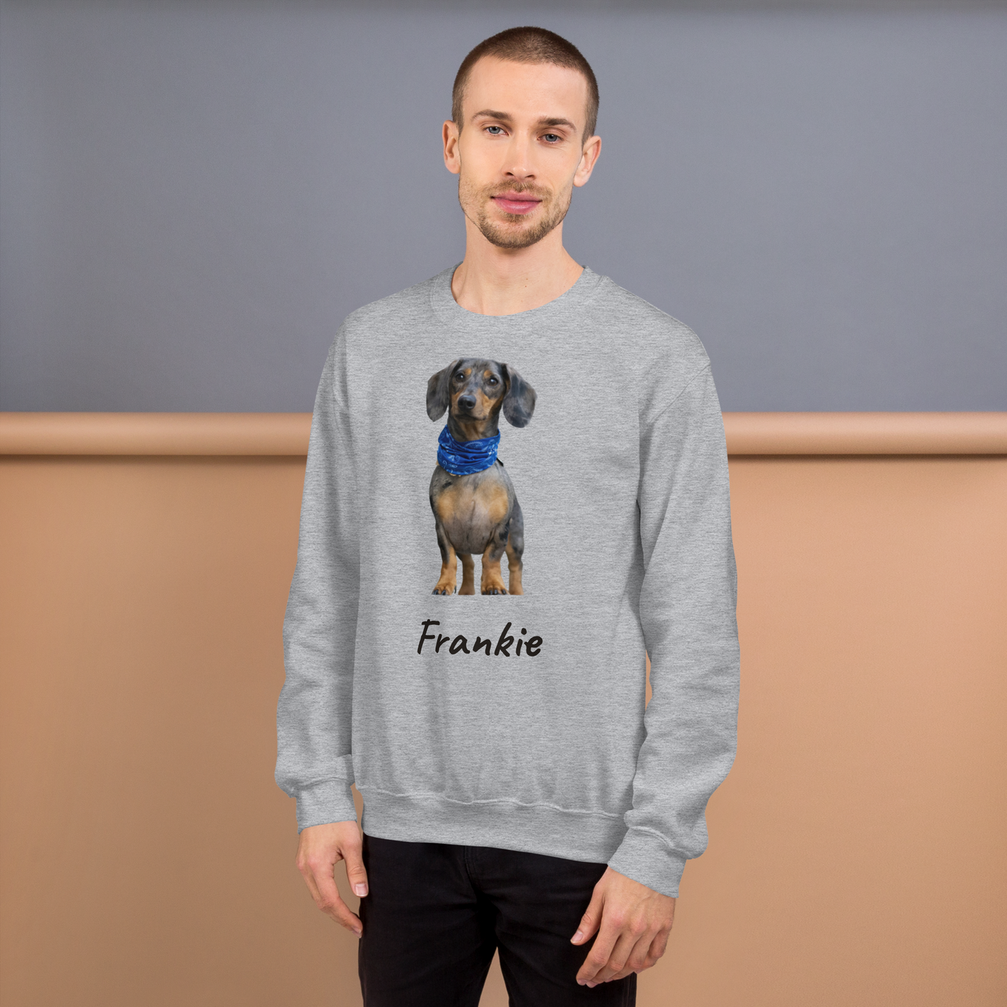 Man wearing a Sport Grey custom pet photo sweatshirt with his dachshund printed on the front