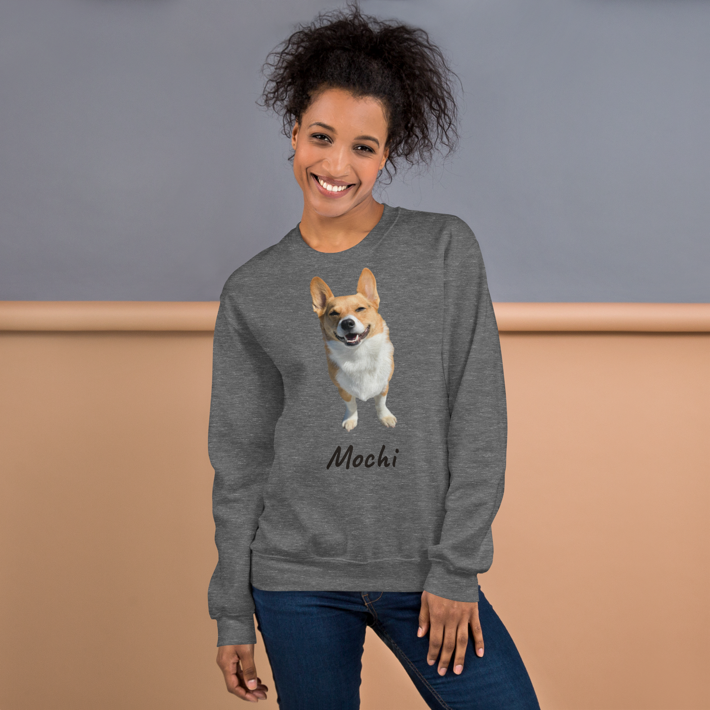 Woman wearing a Graphite Heather grey personalized corgi photo sweatshirt, dog mom gift