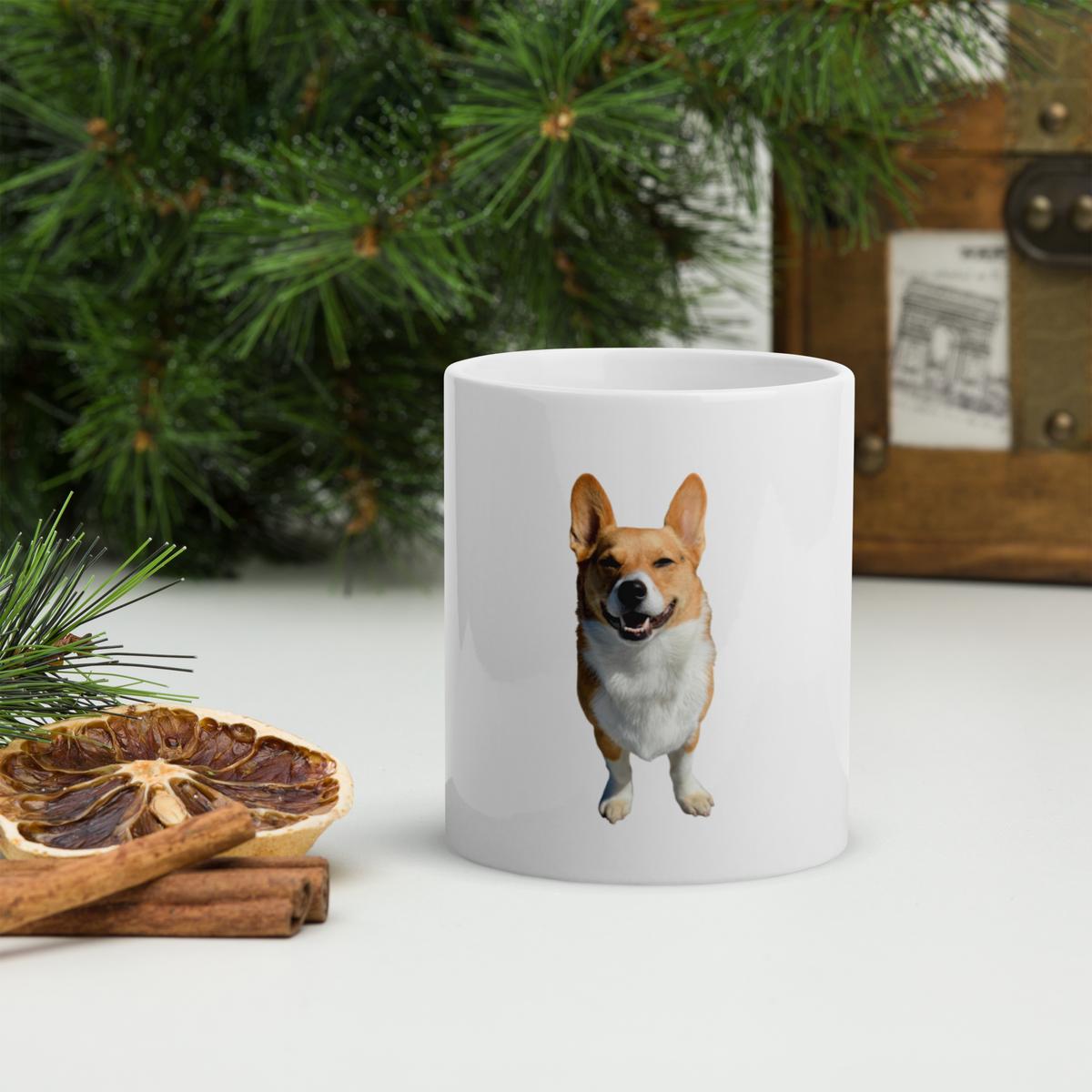 Custom corgi photo mug beside evergreen sprigs at Christmas, holiday gift for corgi owners